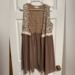 Brown sleeveless vest with cream-colored floral embroidery